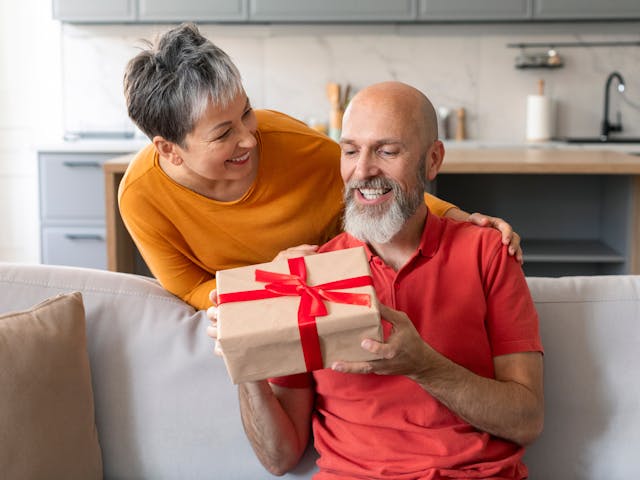 Man and woman exchanging gift