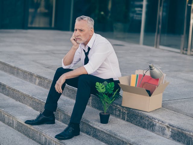 Man sitting with box