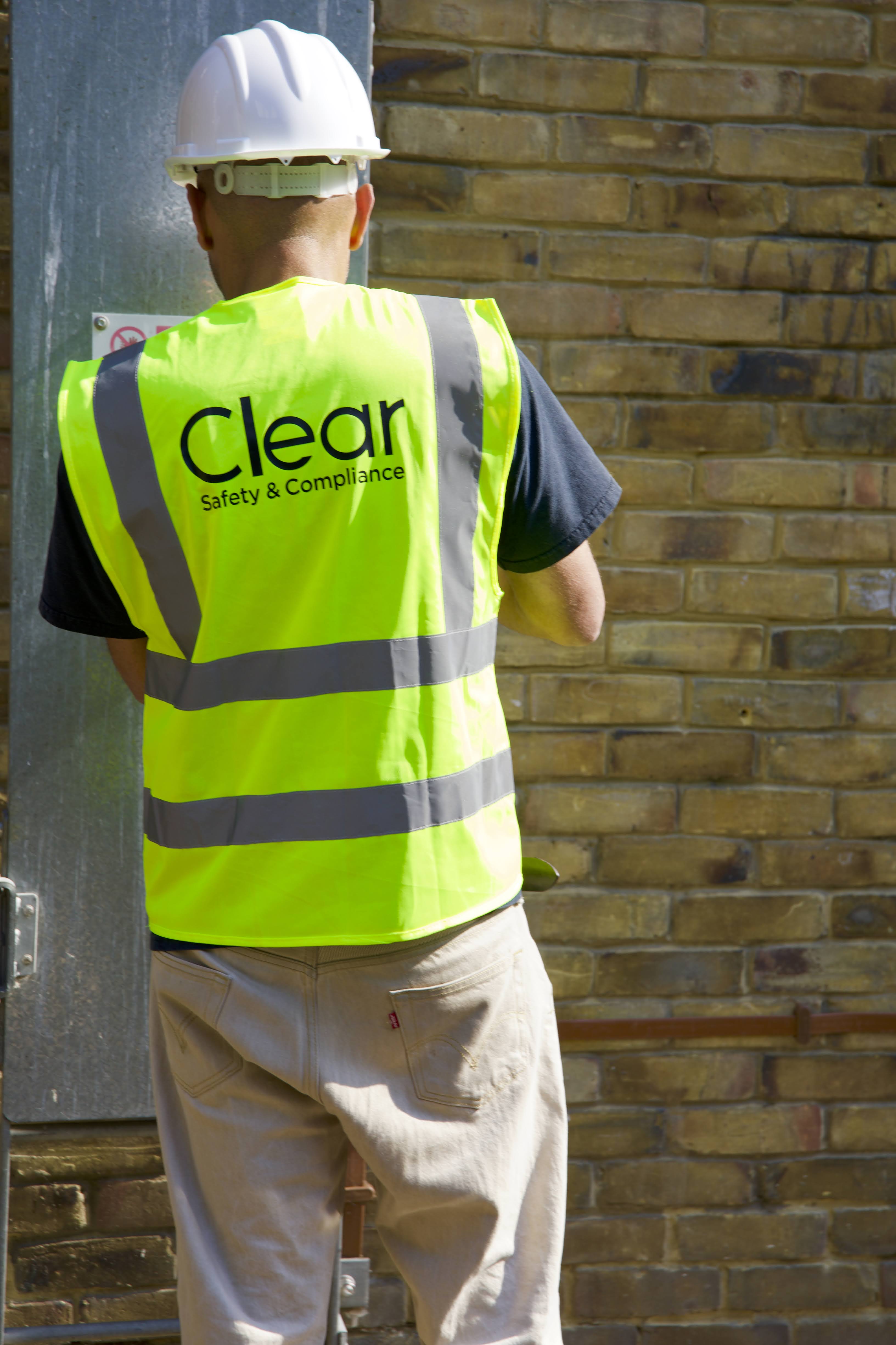 Clear Safety inspector wearing hard hat and high vis