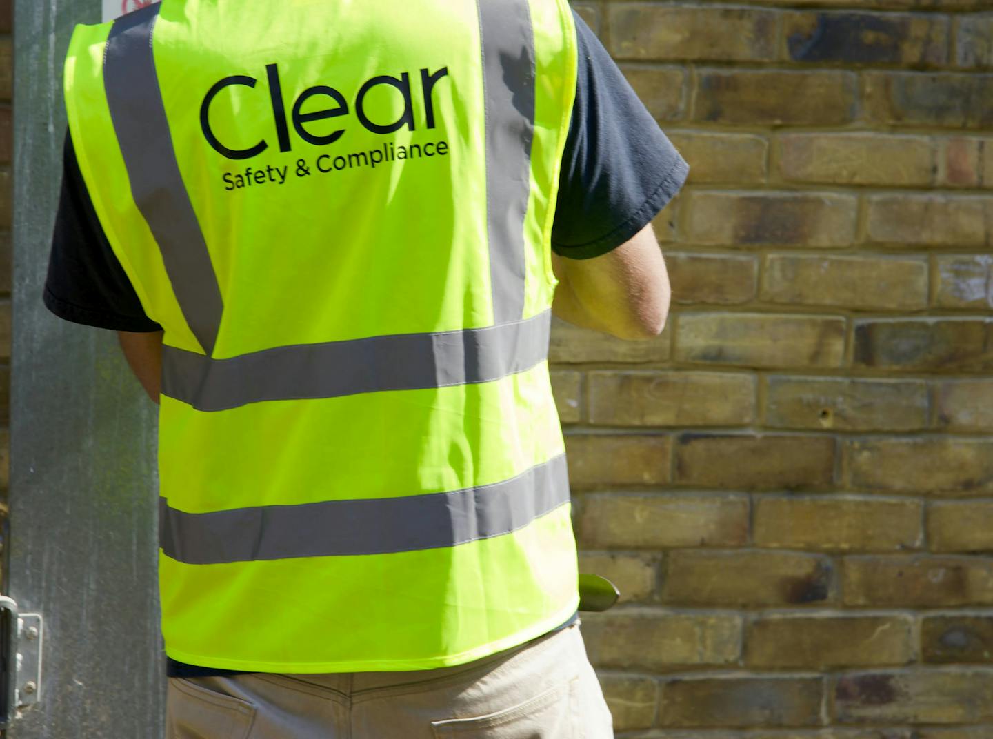 Clear Safety inspector wearing hard hat and high vis
