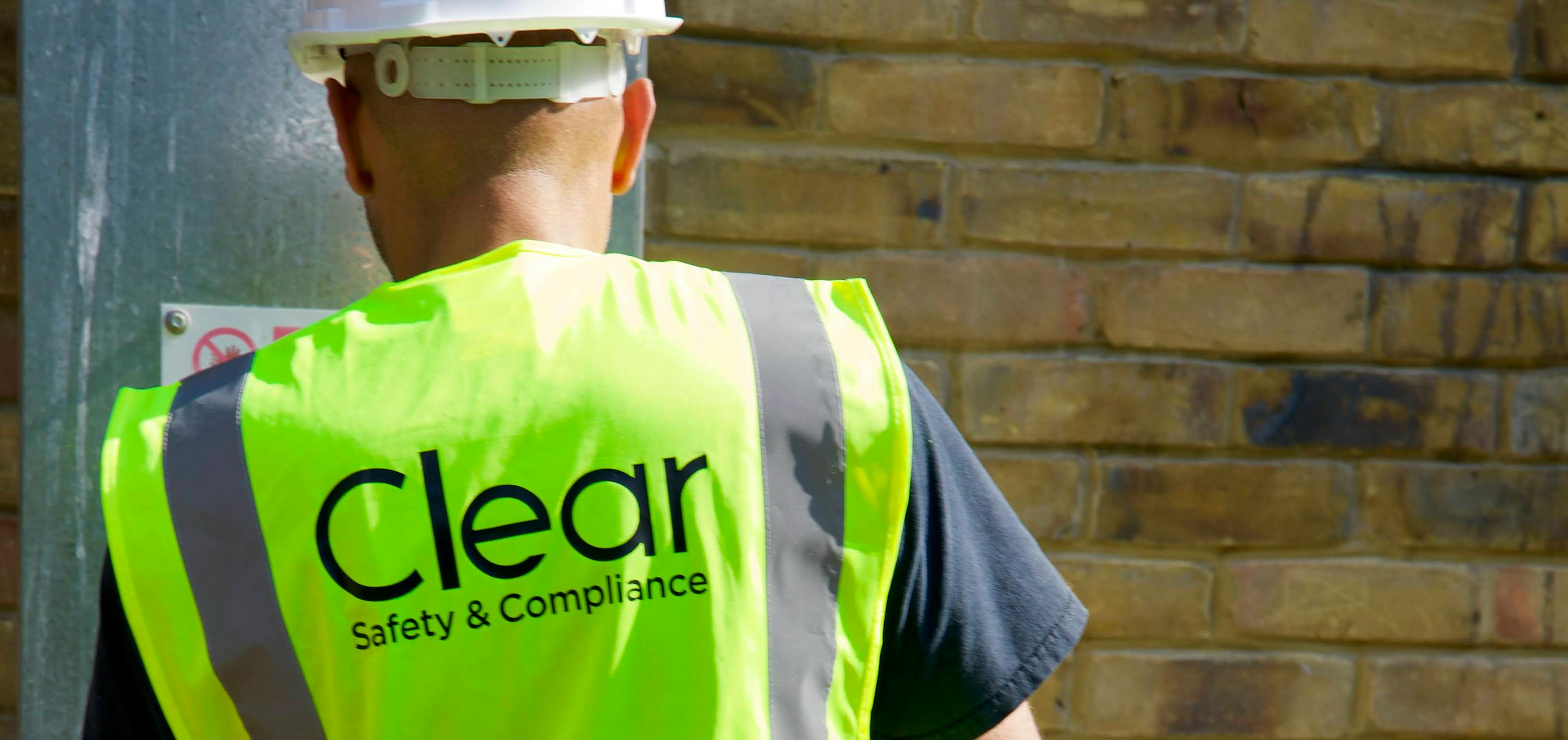 Clear Safety inspector wearing hard hat and high vis