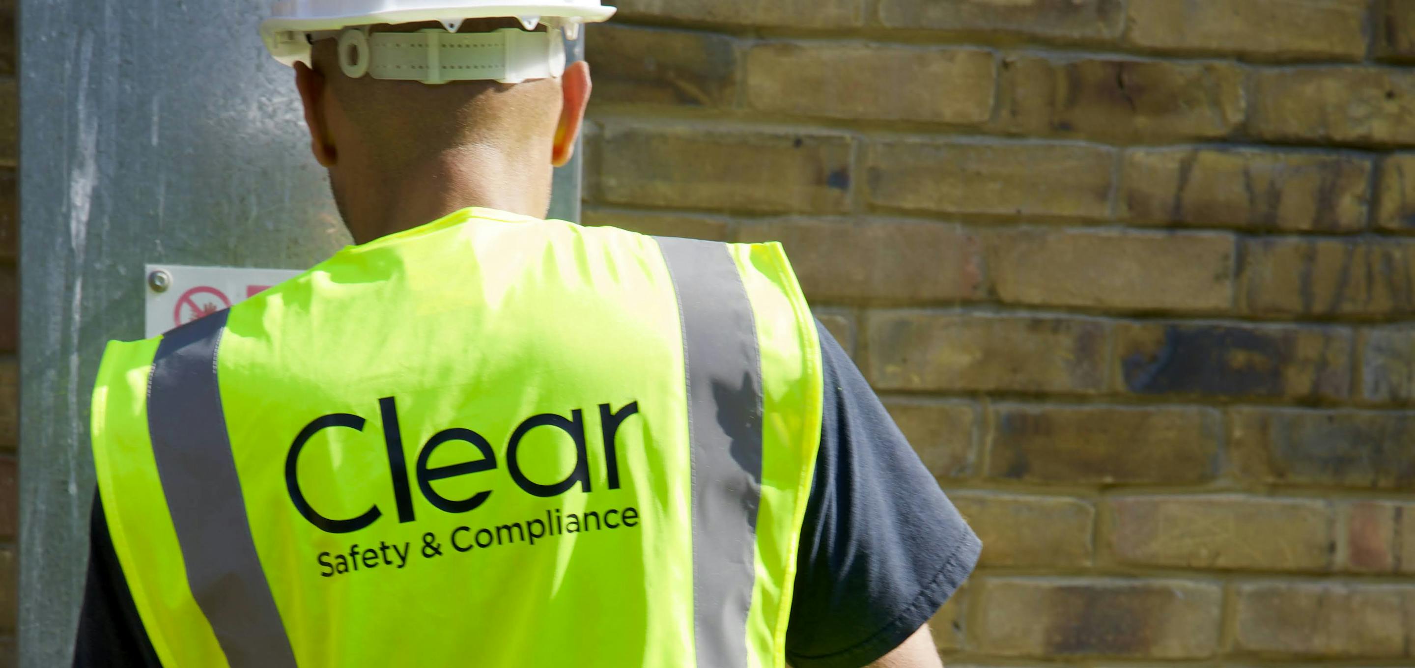 Clear Safety inspector wearing hard hat and high vis
