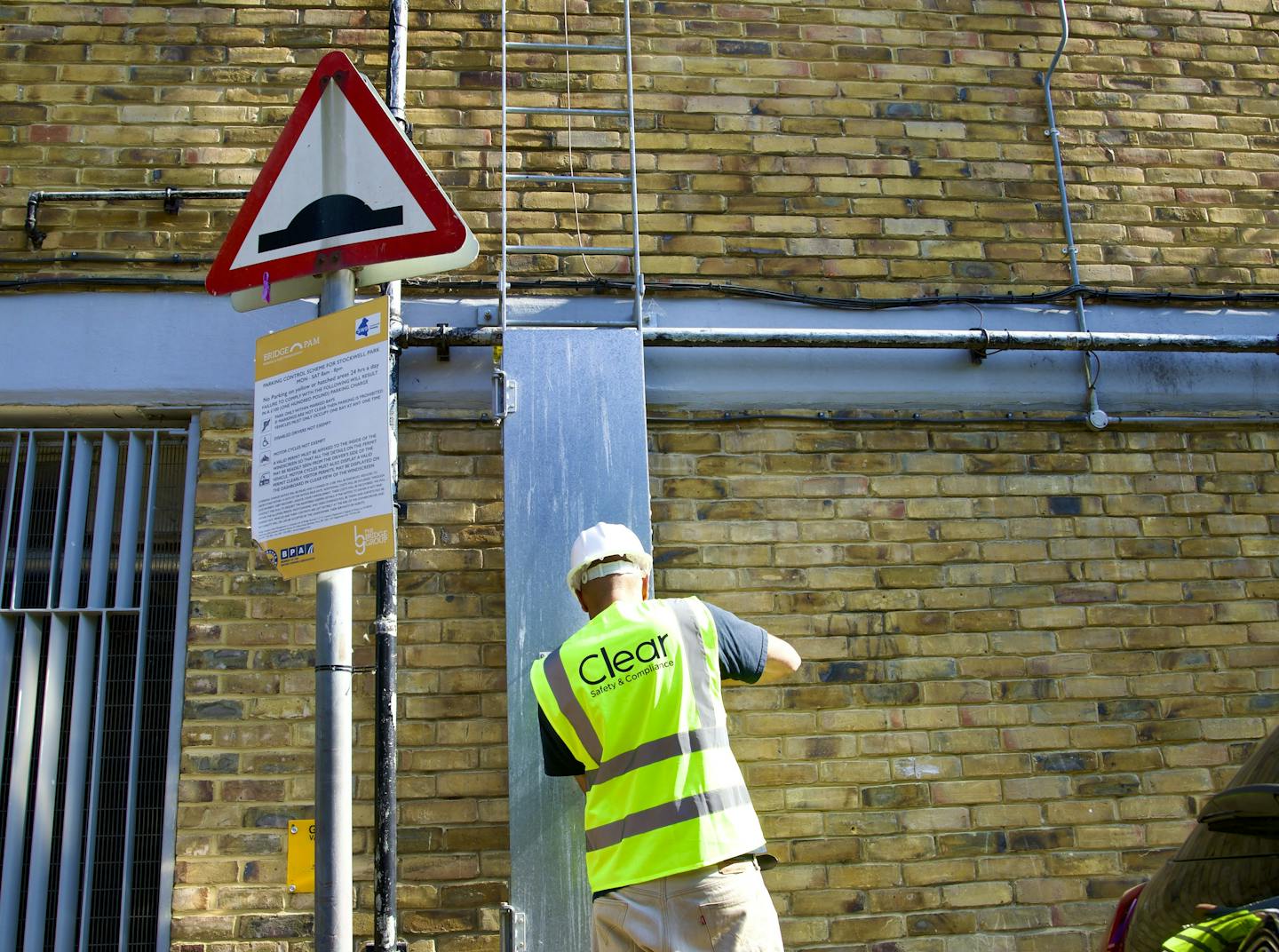 Inspector about to climb ladder to view external vents
