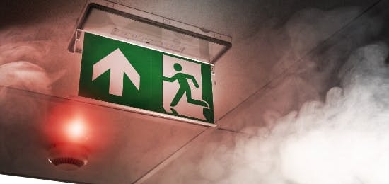 Fire exit signage sounded by smoke