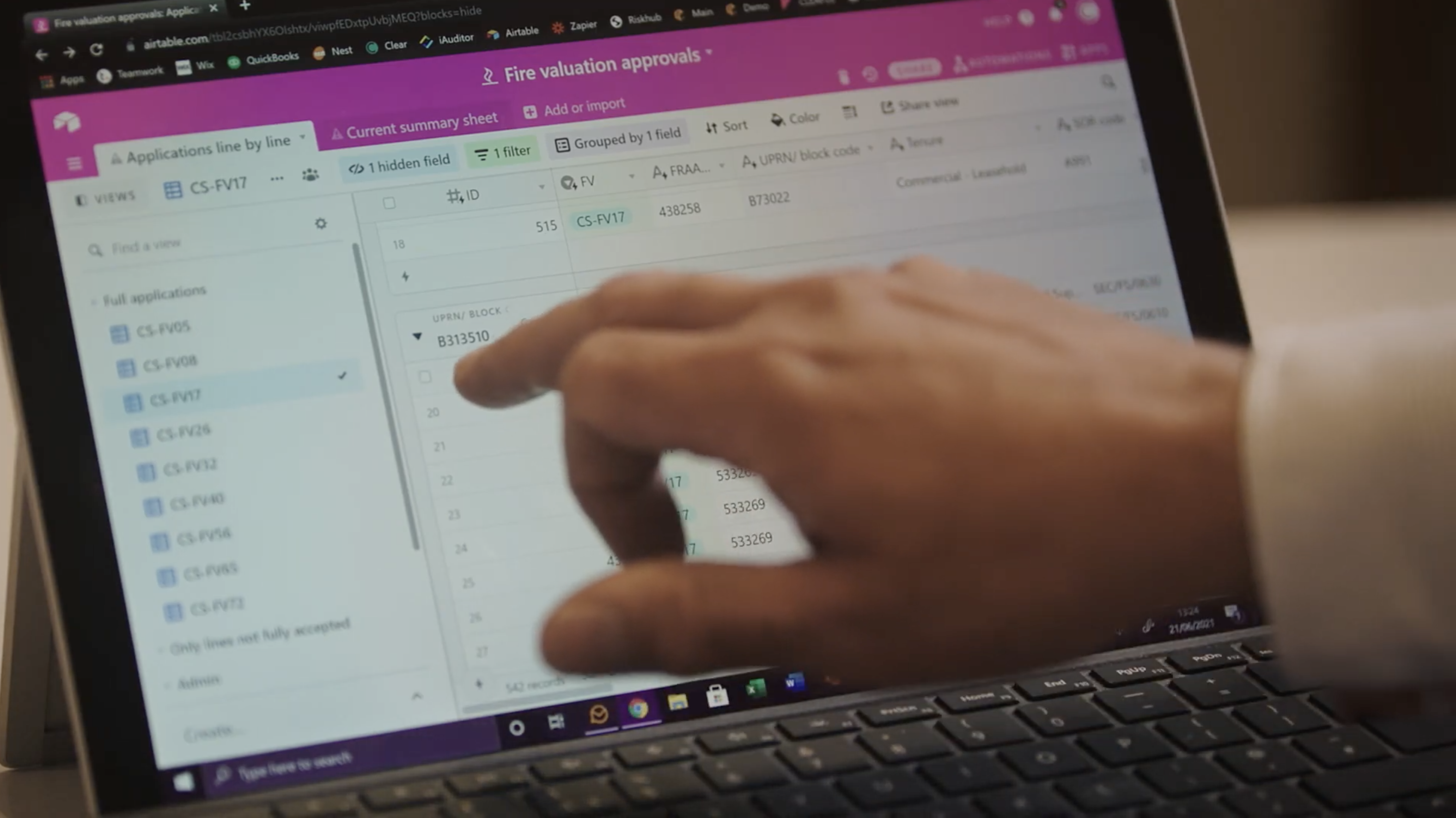 Person using touch screen notebook