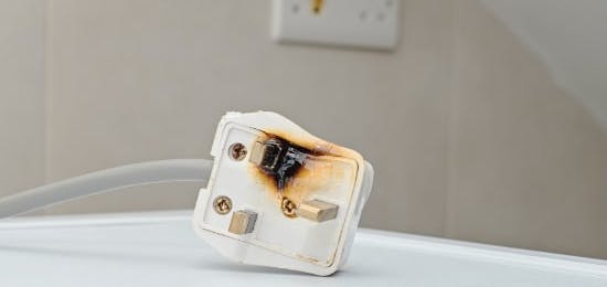 burned electrical plug