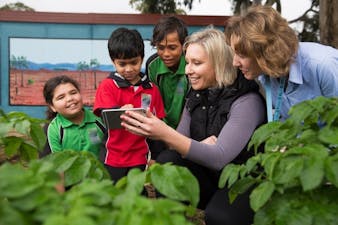 CEO Vanessa Rauland showing the ClimateClever platform to some of our school users