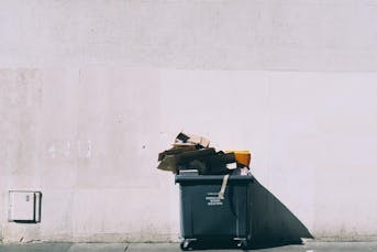 Image of an overflowing recycling bin