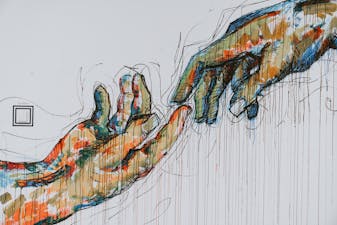 Image of two hand almost touching symbolizing a partnership
