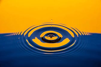 Image of a drop over a water surface