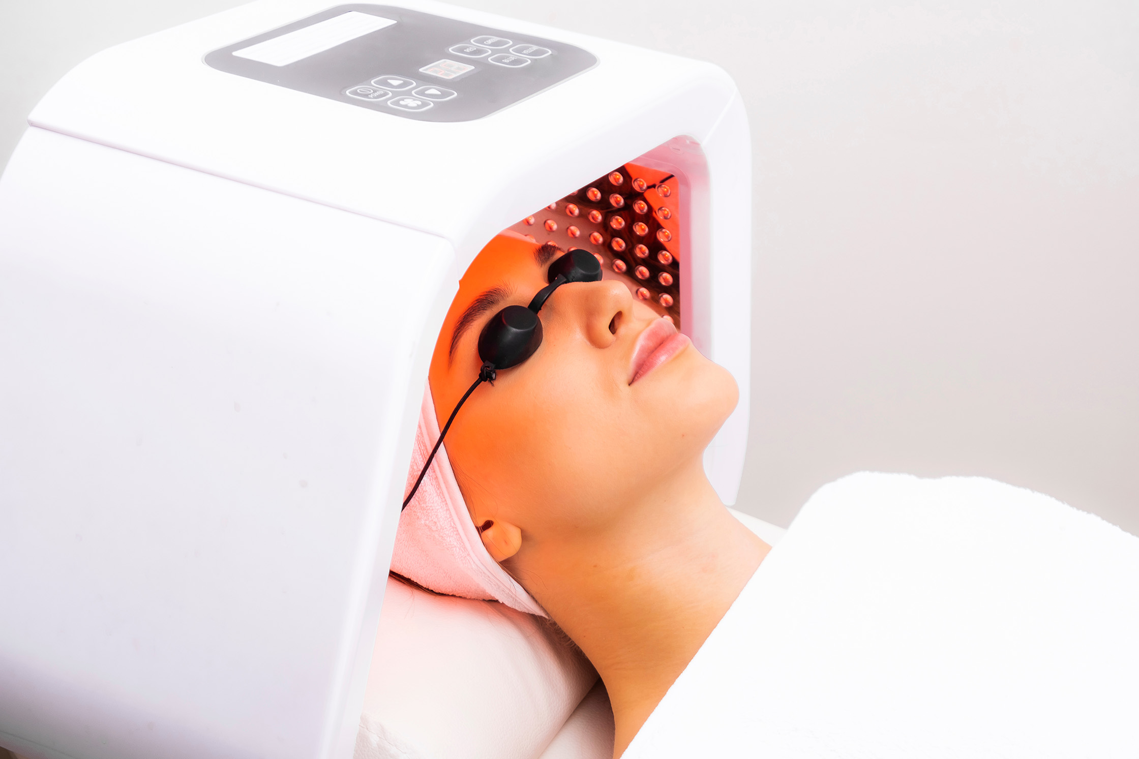 A female patient receiving Dermalux Flex LED Phototherapy