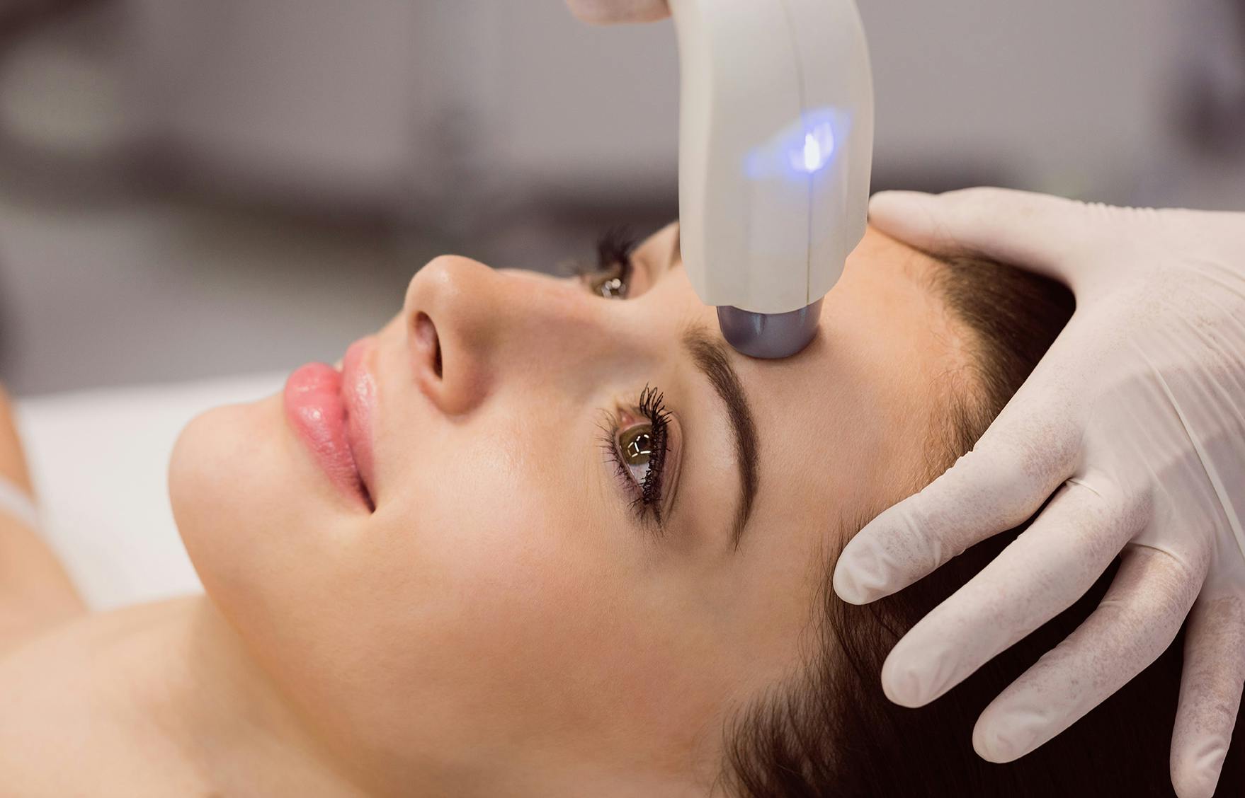 A woman having Focus Facial laser treatment