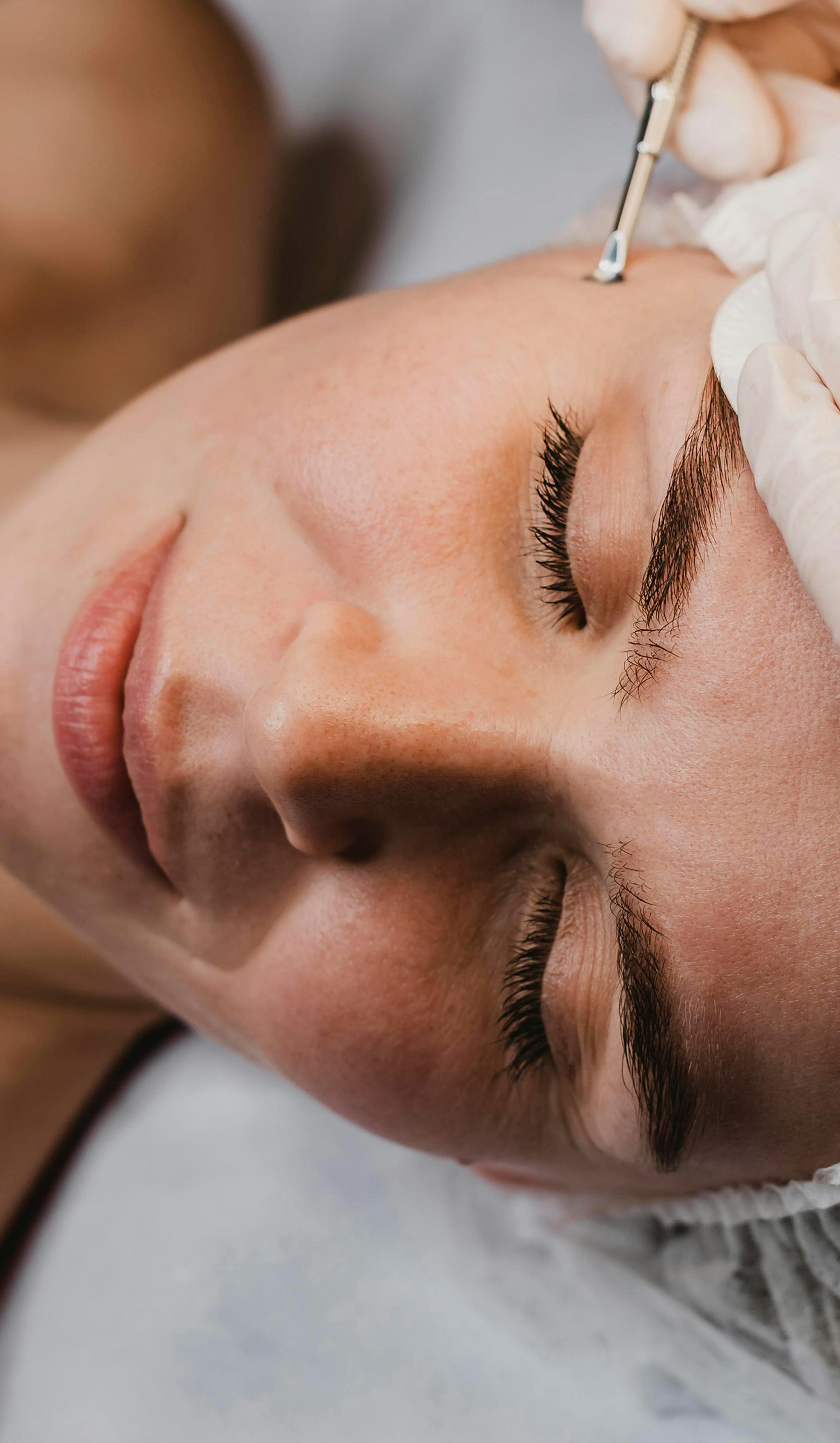 A woman having skin booster treatment