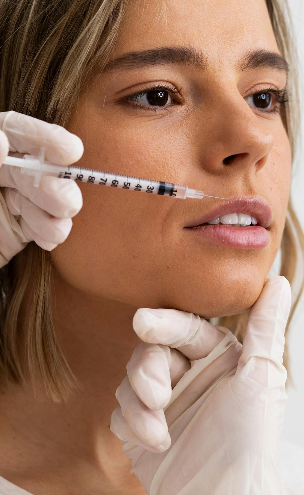 Botox training being done on a woman