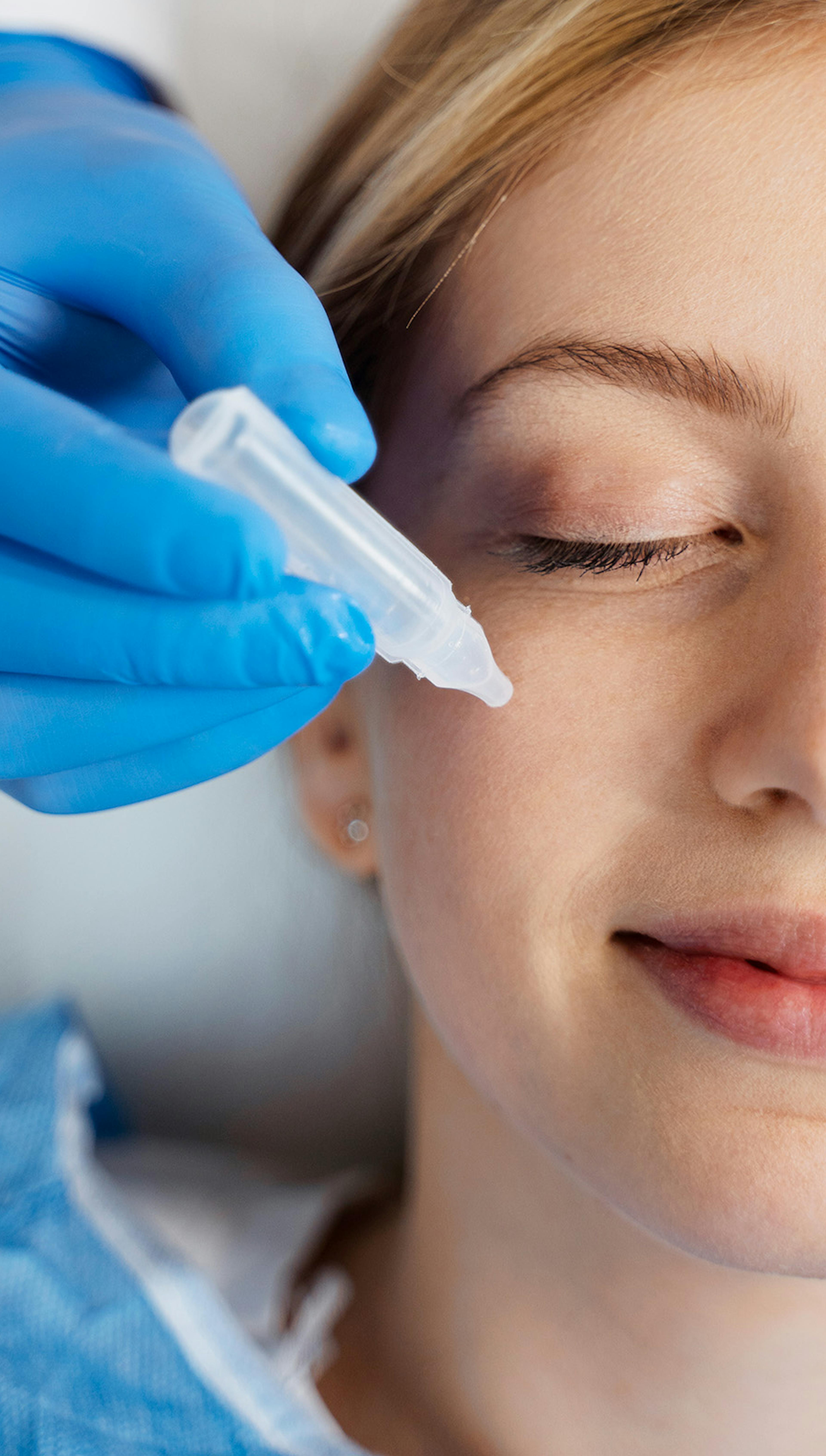 Medical botox training being performed on a woman