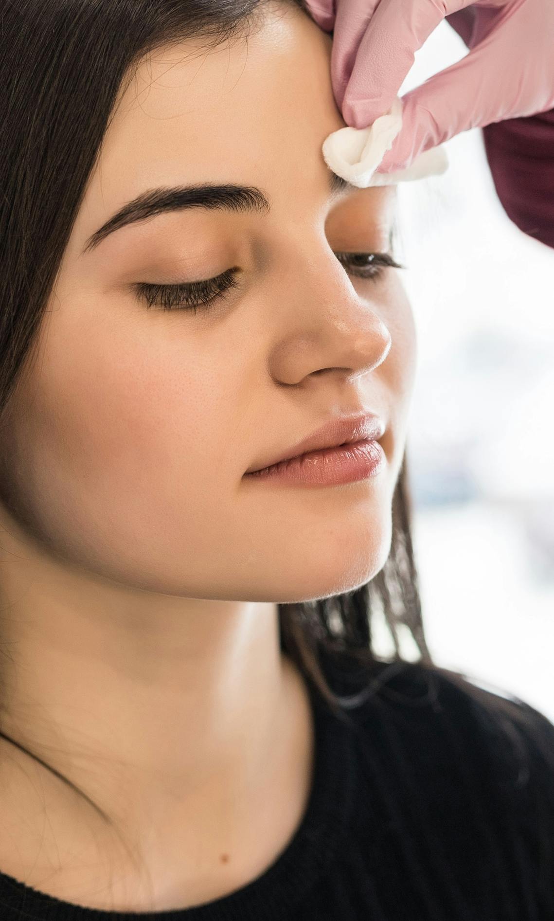Non-surgical rhinoplasty being performed on a female patient