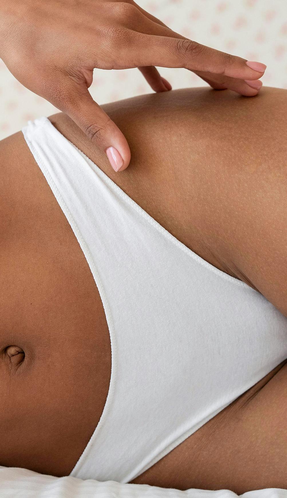 A womans body lying on its side