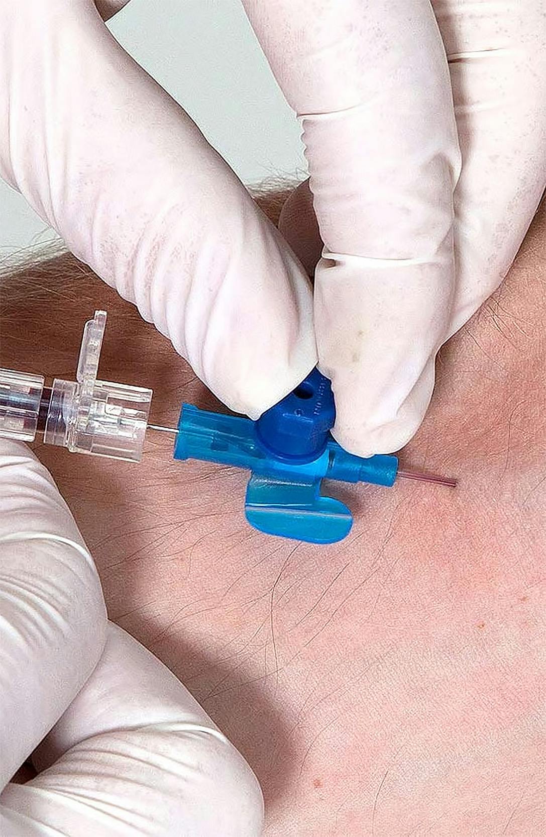 A medical professional conducting cannula training