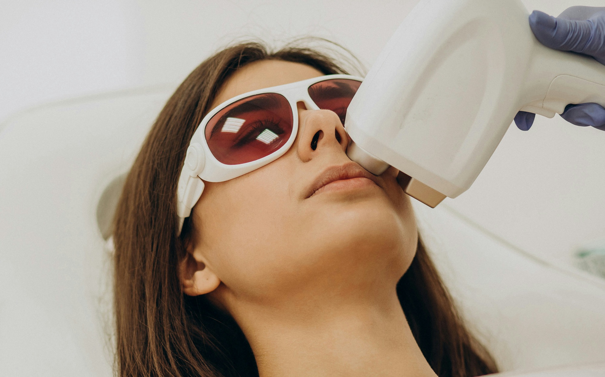 Woman having laser hair removal treatment