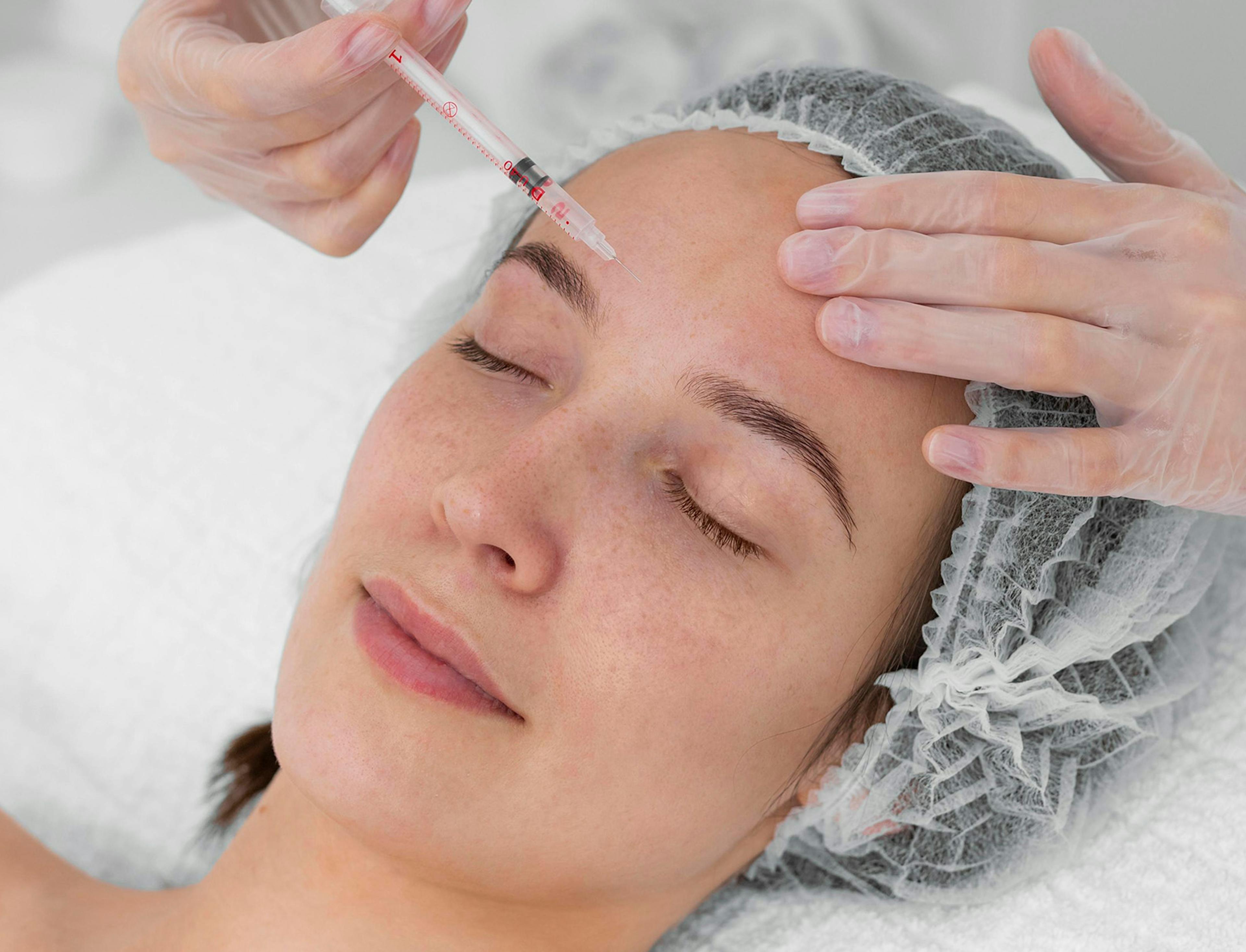 woman receiving botox migraine treatment