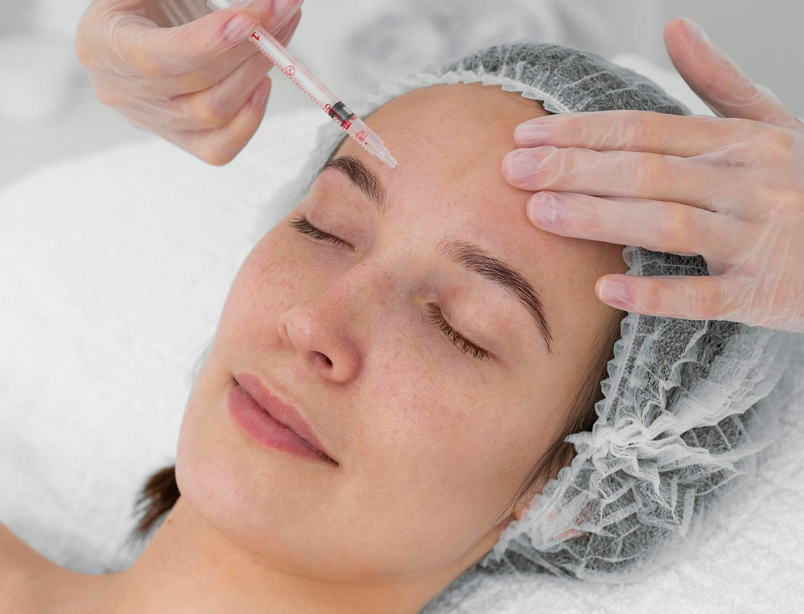 woman receiving botox migraine treatment