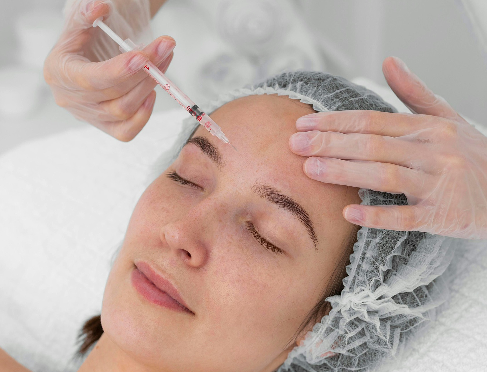 A female patient receiving botox migraine treatment