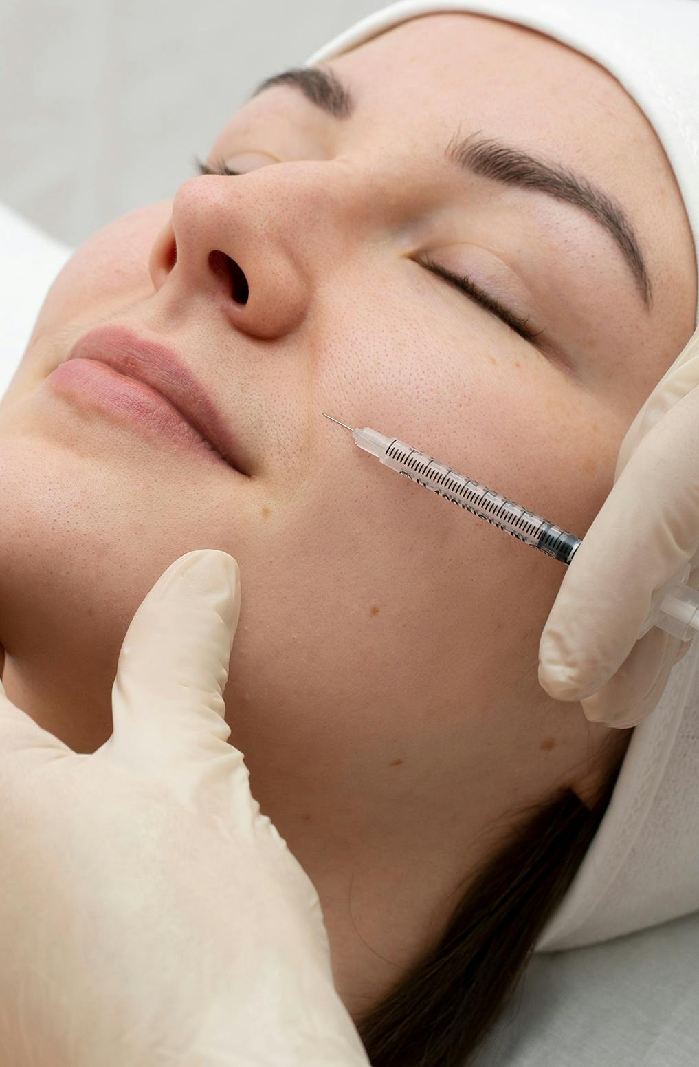 A female patient receiving skin booster treatment