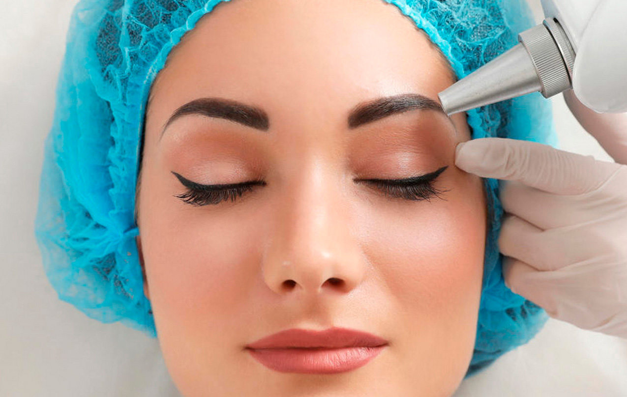 A female patient having laser treatment to remove makeup