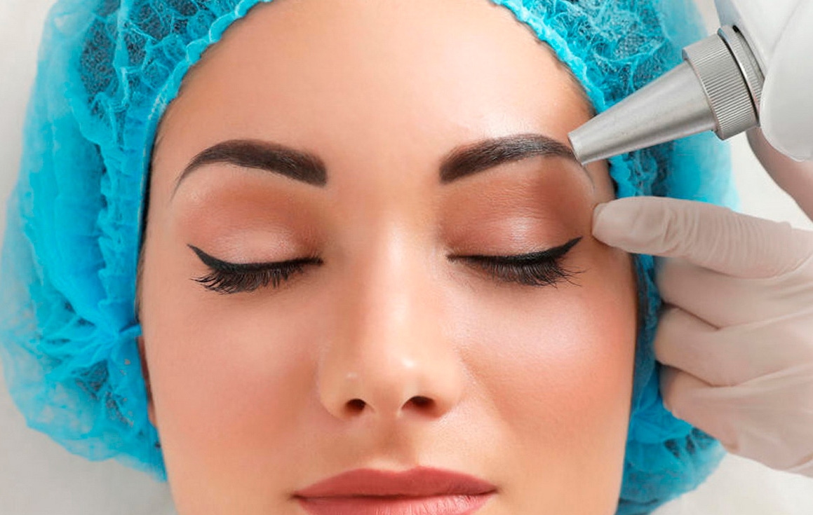 A female patient having laser treatment to remove makeup