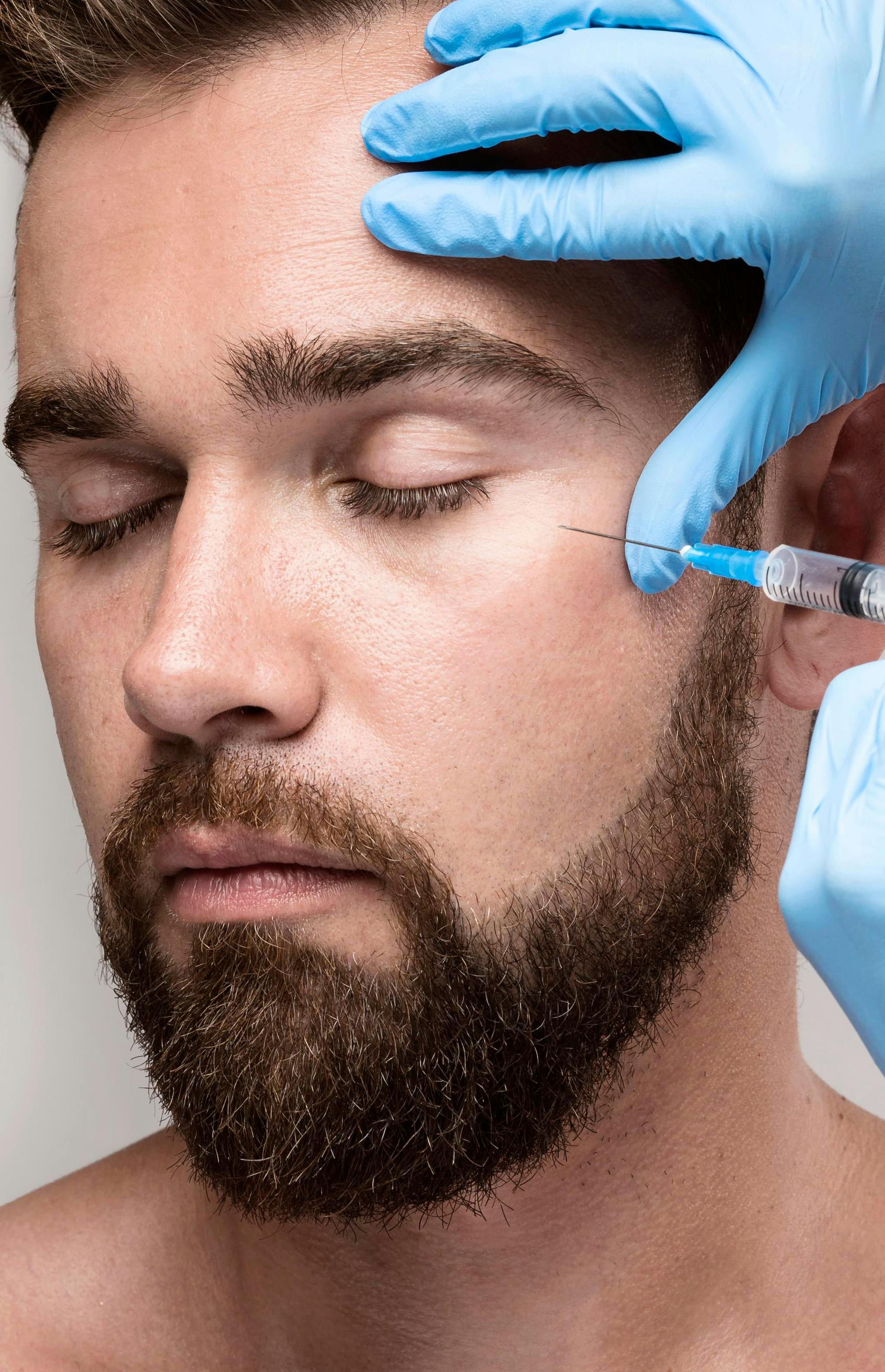A male patient receiving botox treatment
