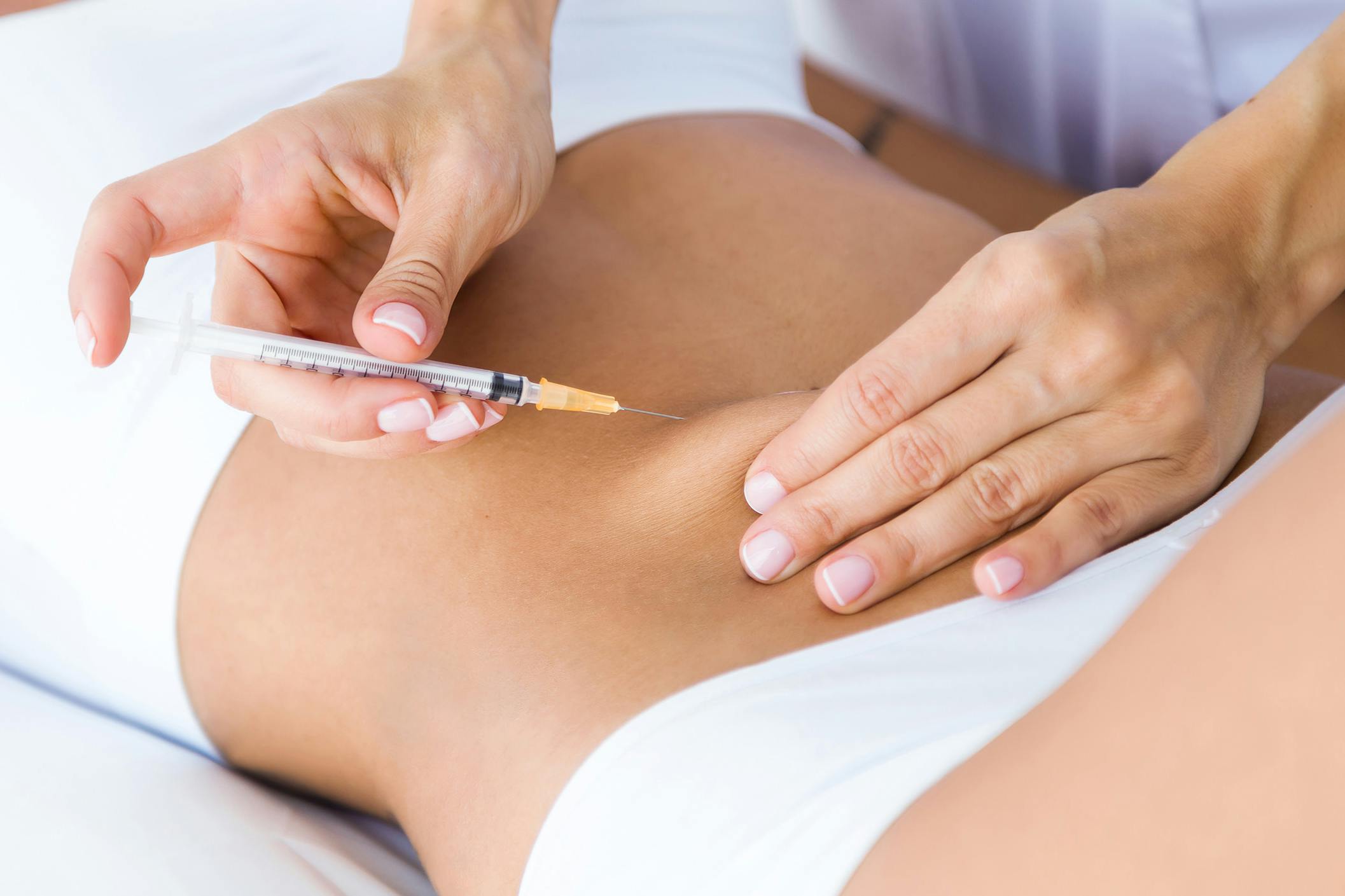 A female patient receiving fat dissolving treatment