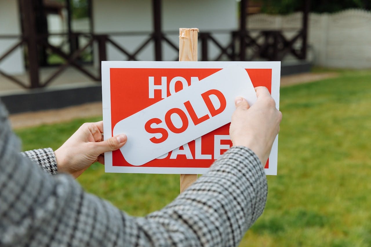 "sold" sign
