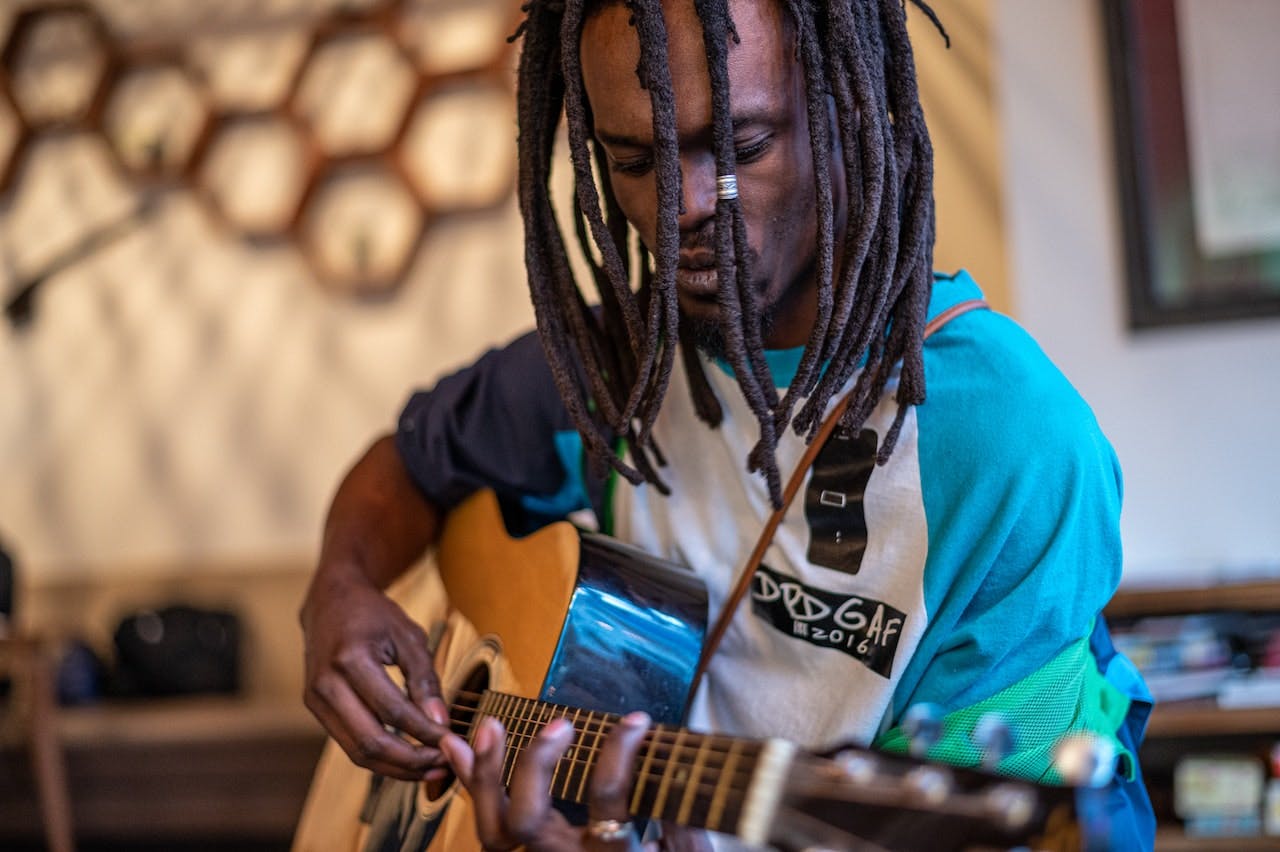 man playing acoustic guitar