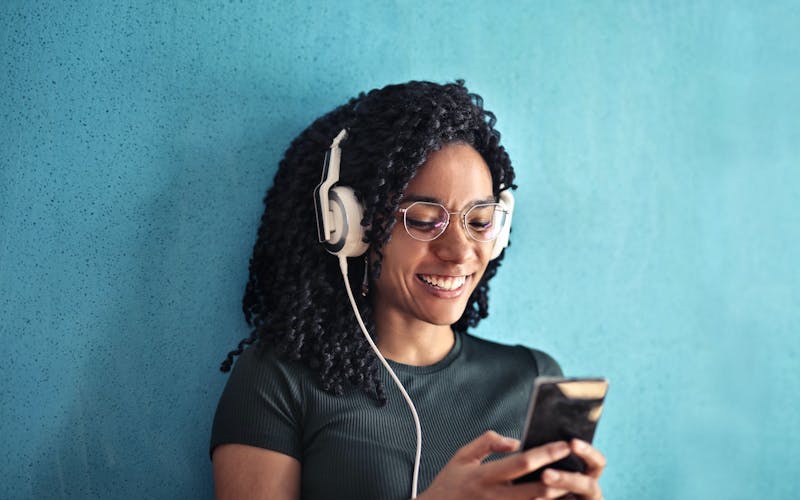 woman listening to music in headphones