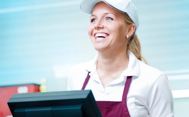 cashier smiling
