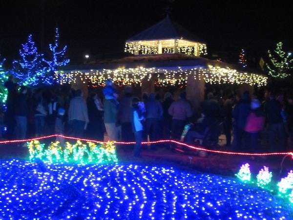 holiday light display with people looking
