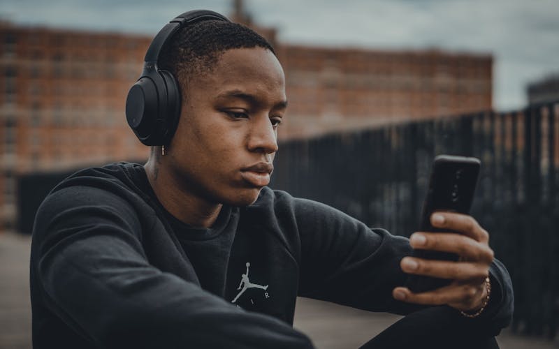 person listening to music in headphones