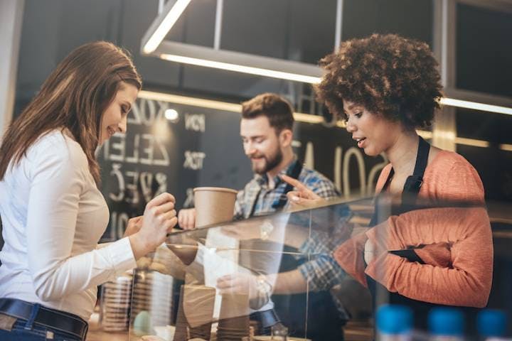 people ordering at a coffee shop