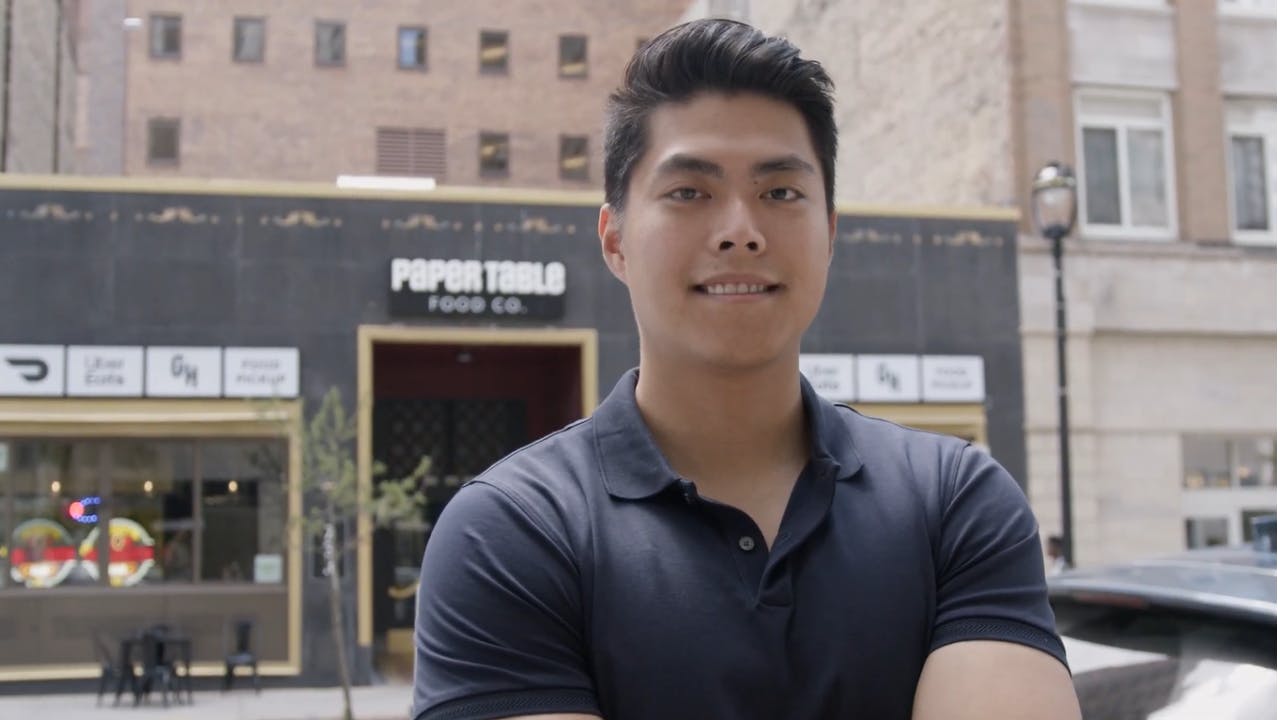 Wesley in front of a ghost kitchen facility