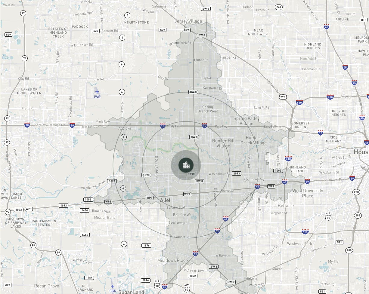 A grey map of the Houston area with roads, street names and cities around it, with a symbol representing a facility on the center of the map