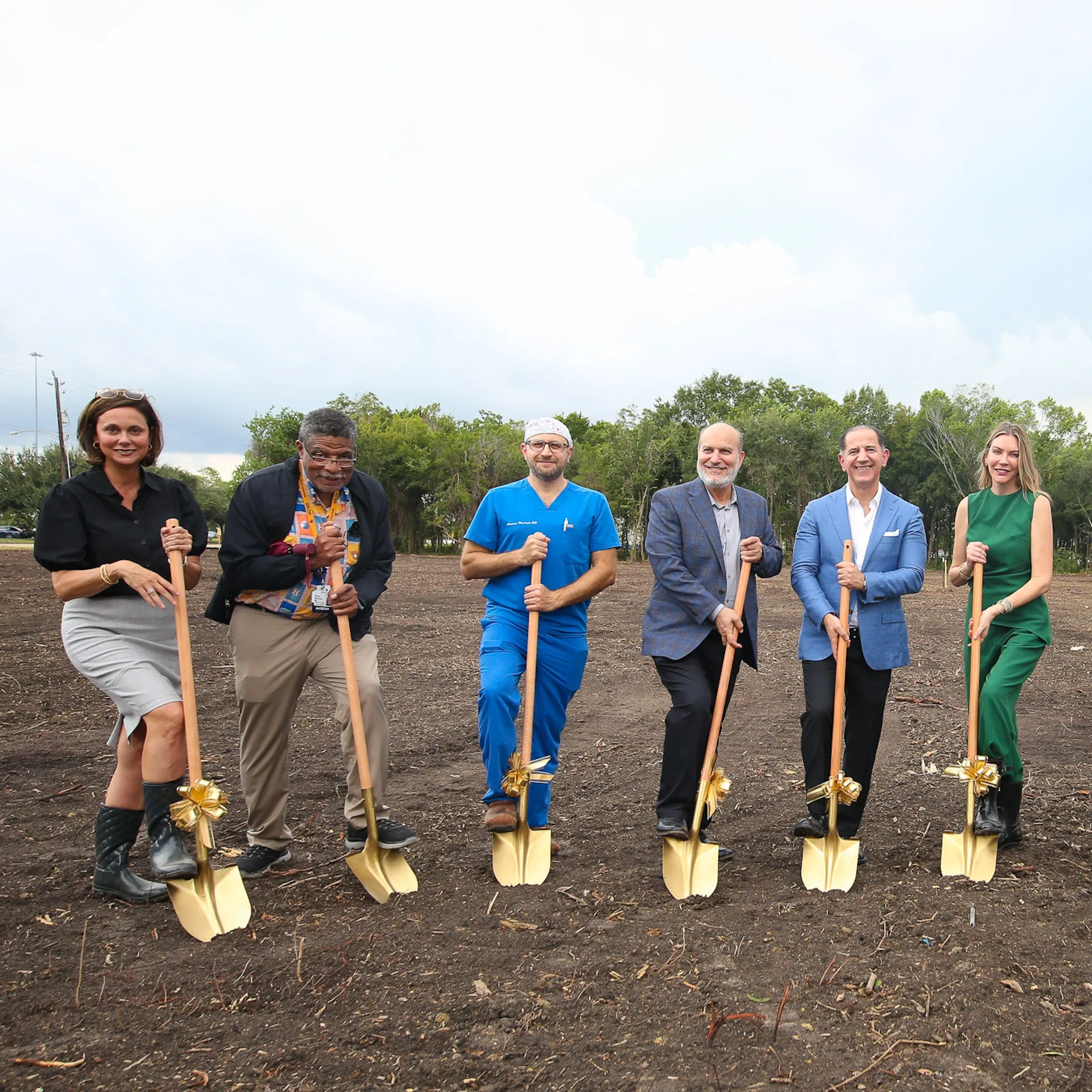 CLS Health's leadership holding shovels, signifying rapid expansion.