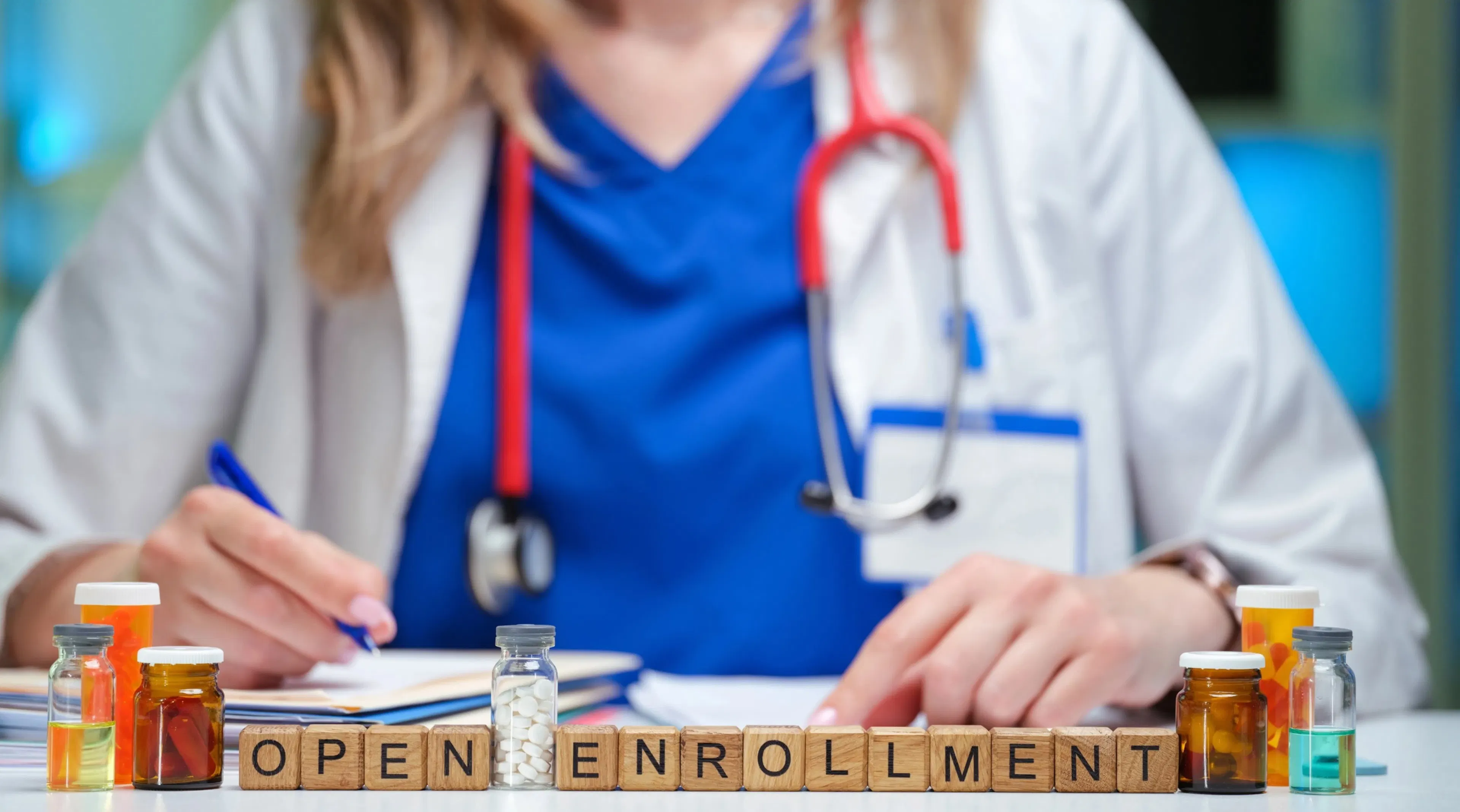 Open enrollment letters ae shown in front of a doctor.