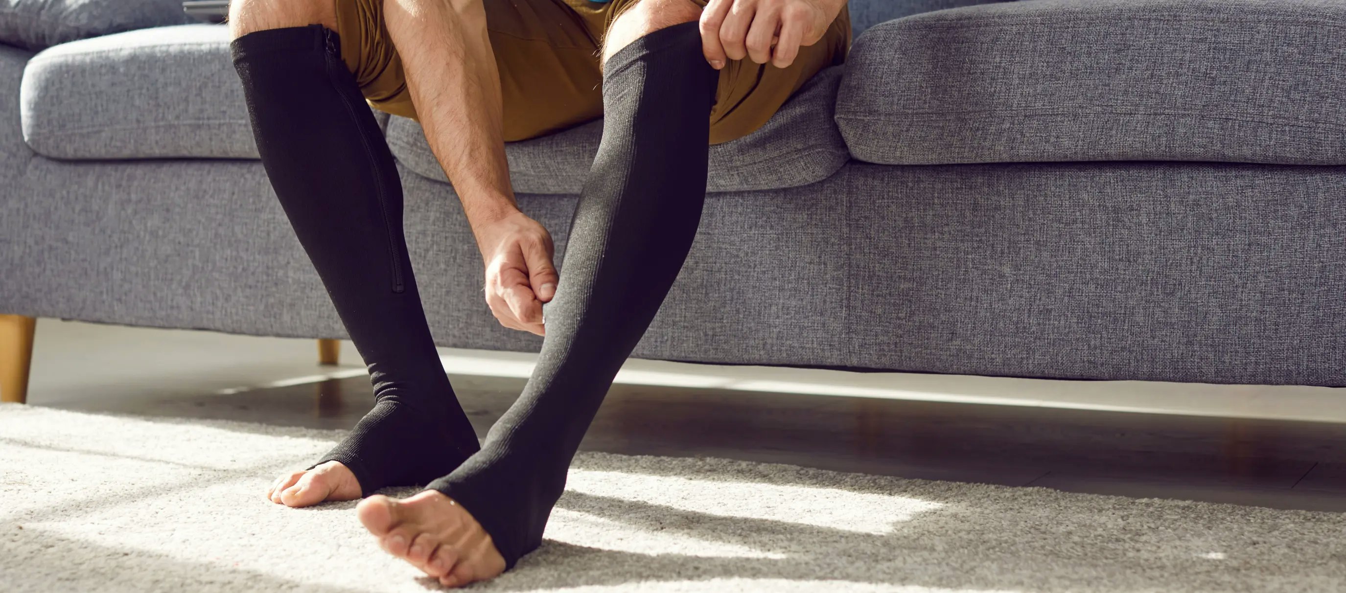 Close-up of compression socks on legs, highlighting their use for improving circulation, reducing swelling, and preventing varicose veins.