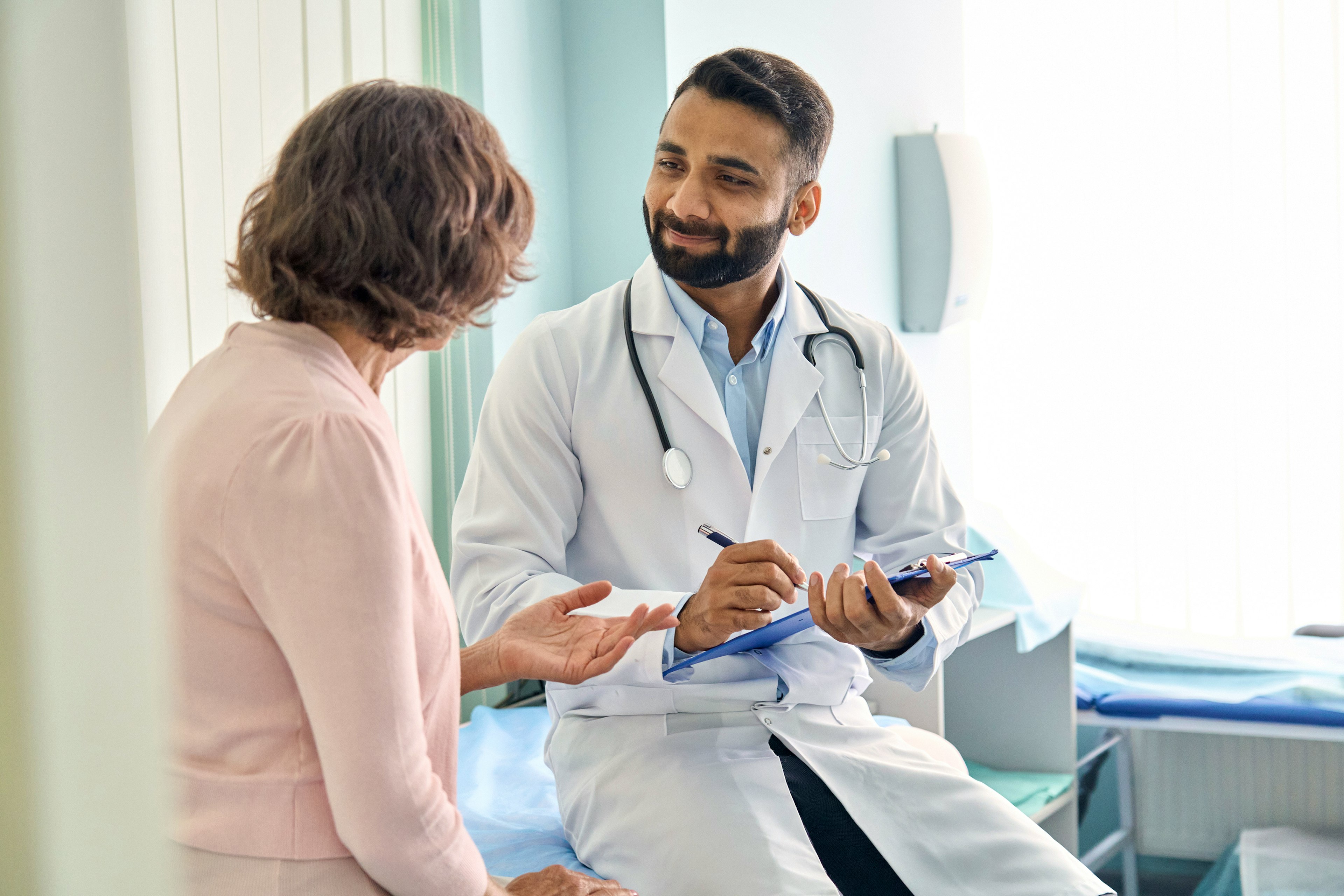 A doctor consulting with a female patient