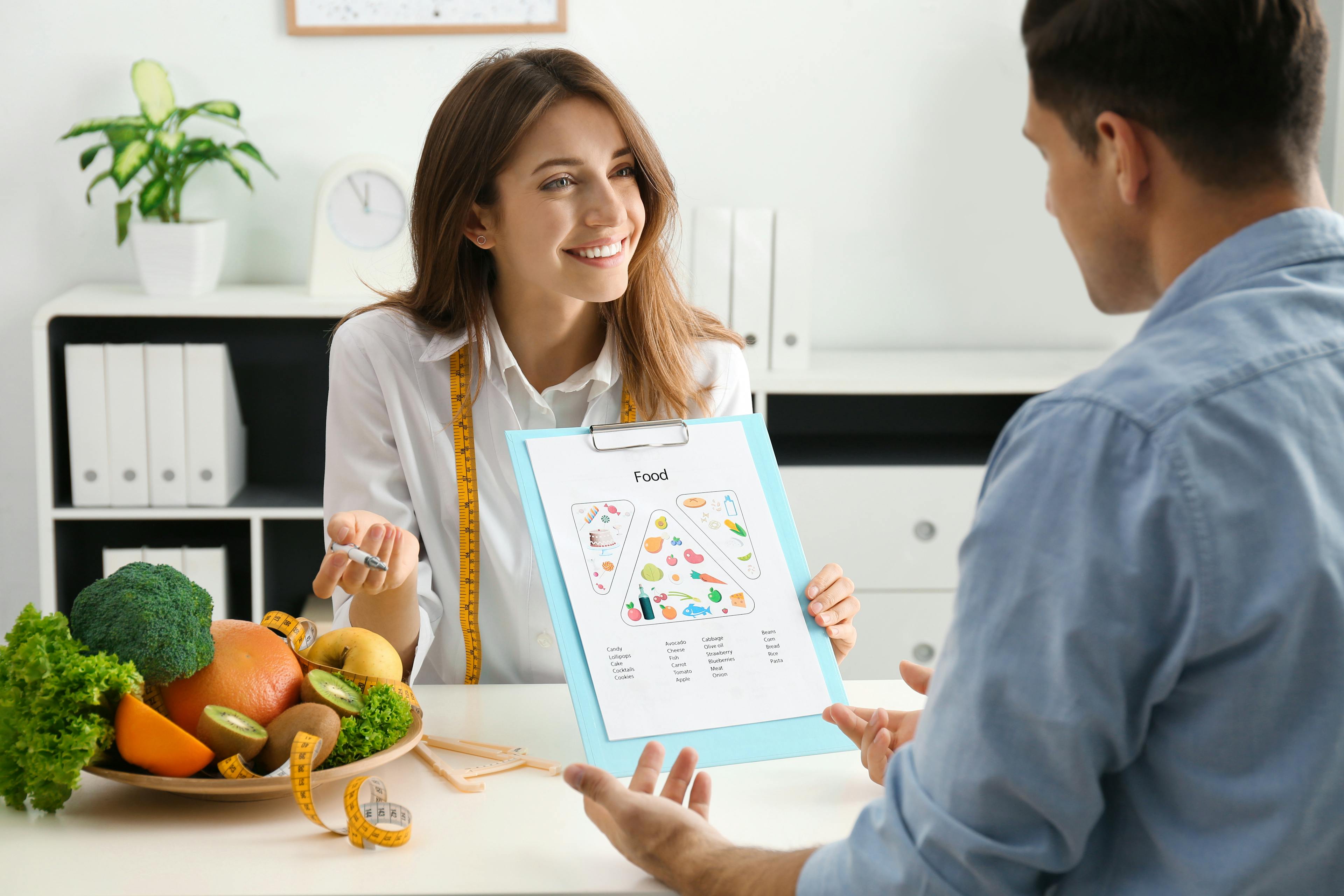 A dietitian is educating a patient on healthy eating and curating a diet plan. 