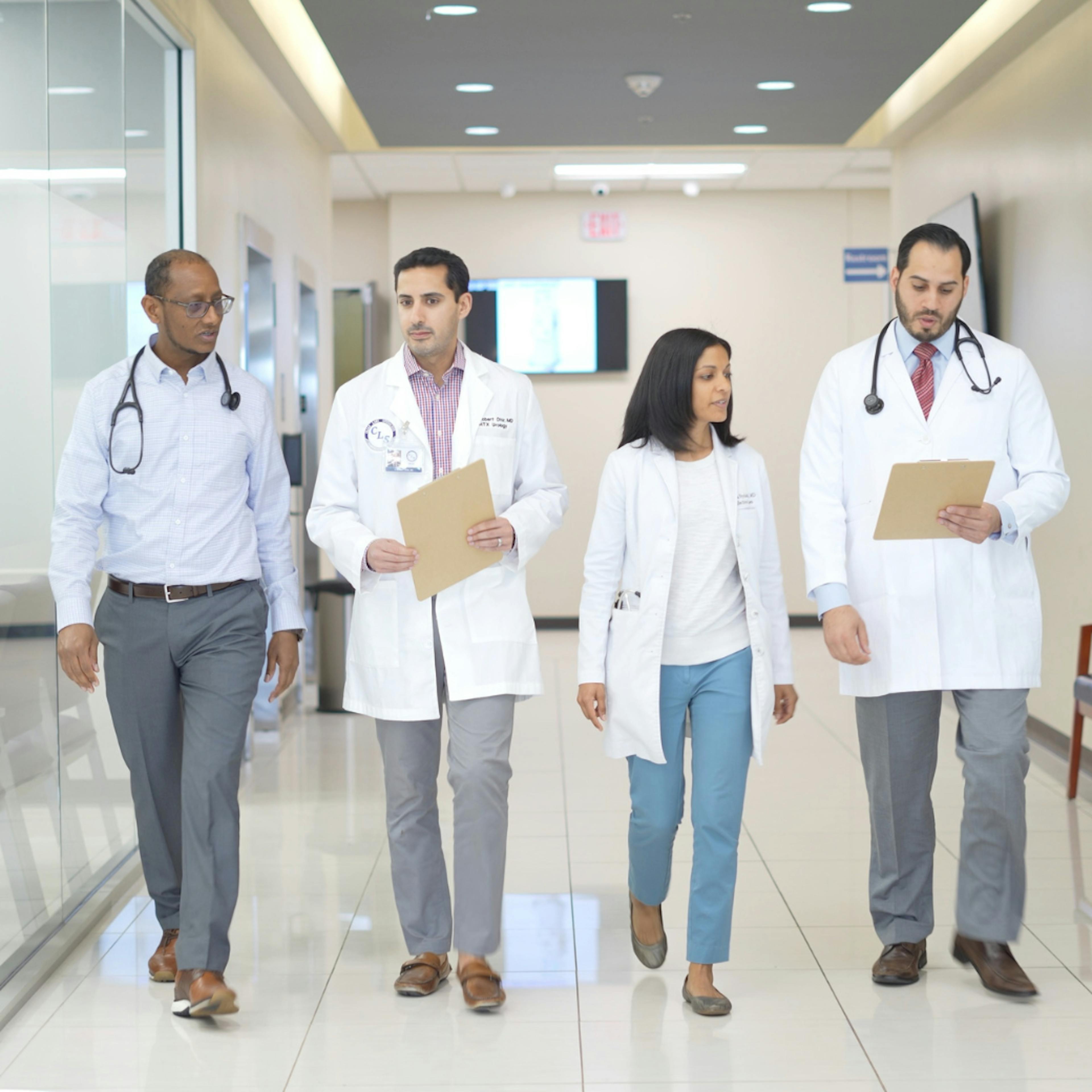 A group of CLS Health doctors posing together, showcasing teamwork, collaboration, and dedication to patient care.