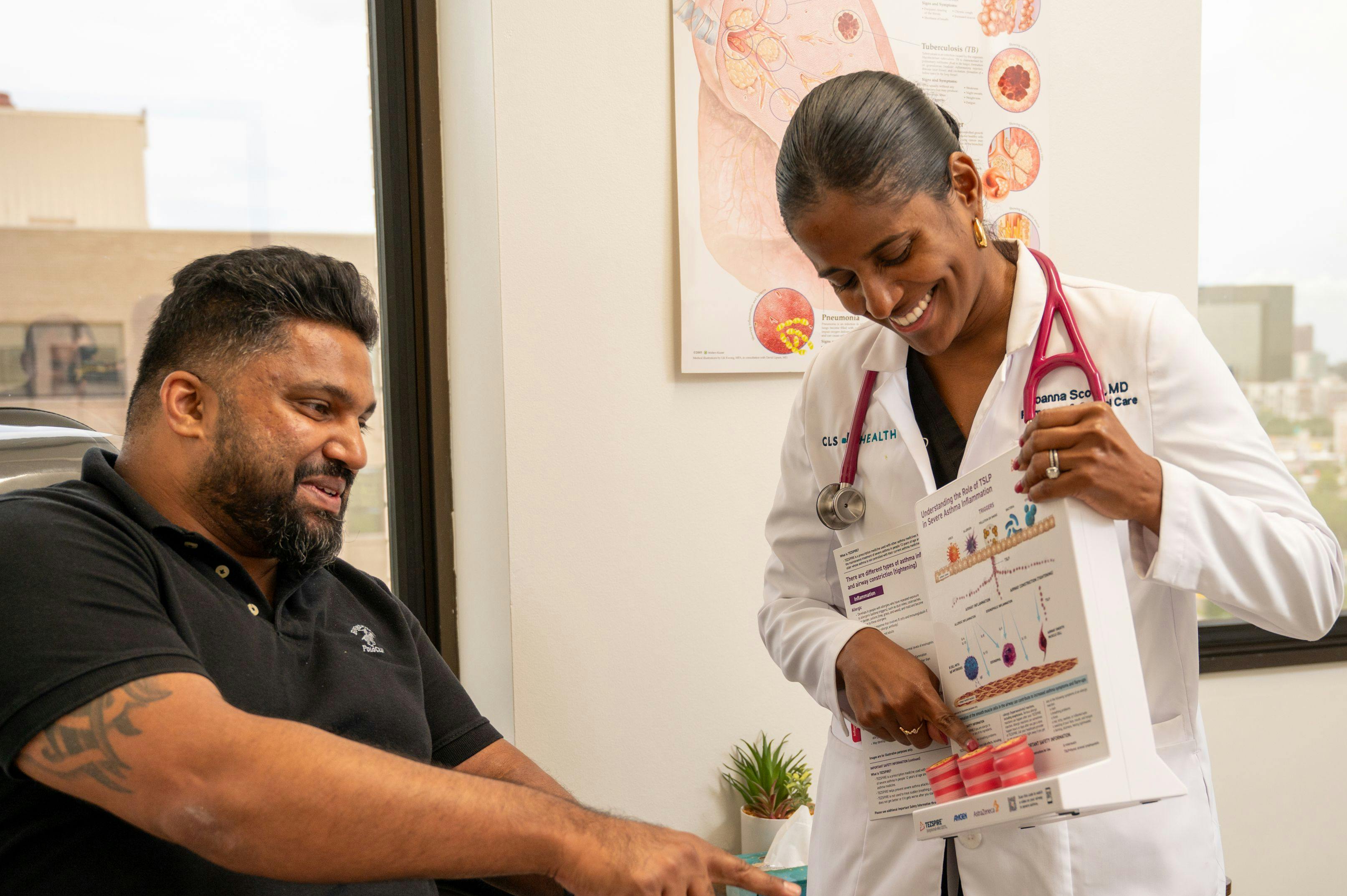 Dr. Joanna Scoon, a CLS Health physician, treating a patient.