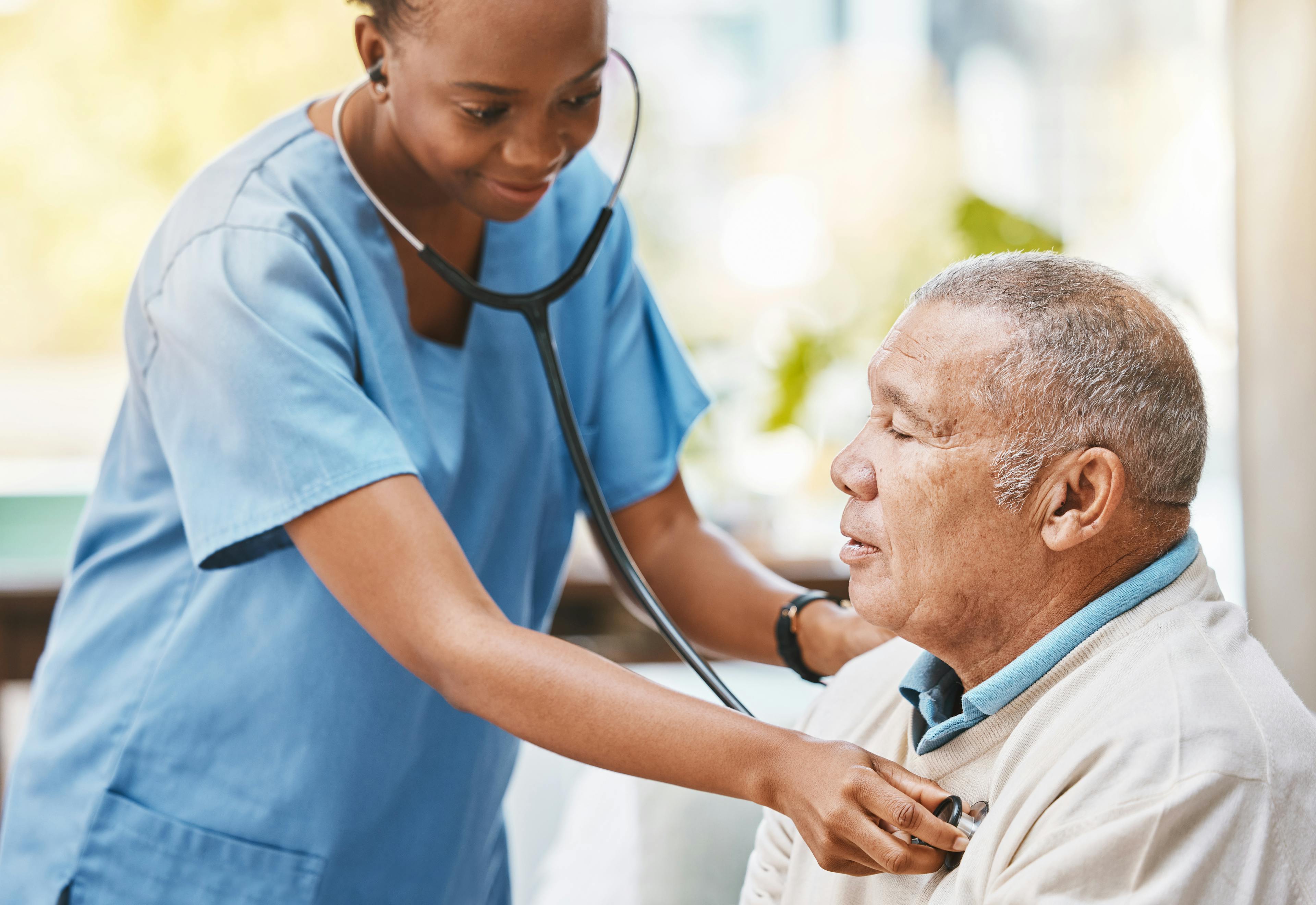 A cardiologist checking a patient's heartbeat with a stethoscope.
