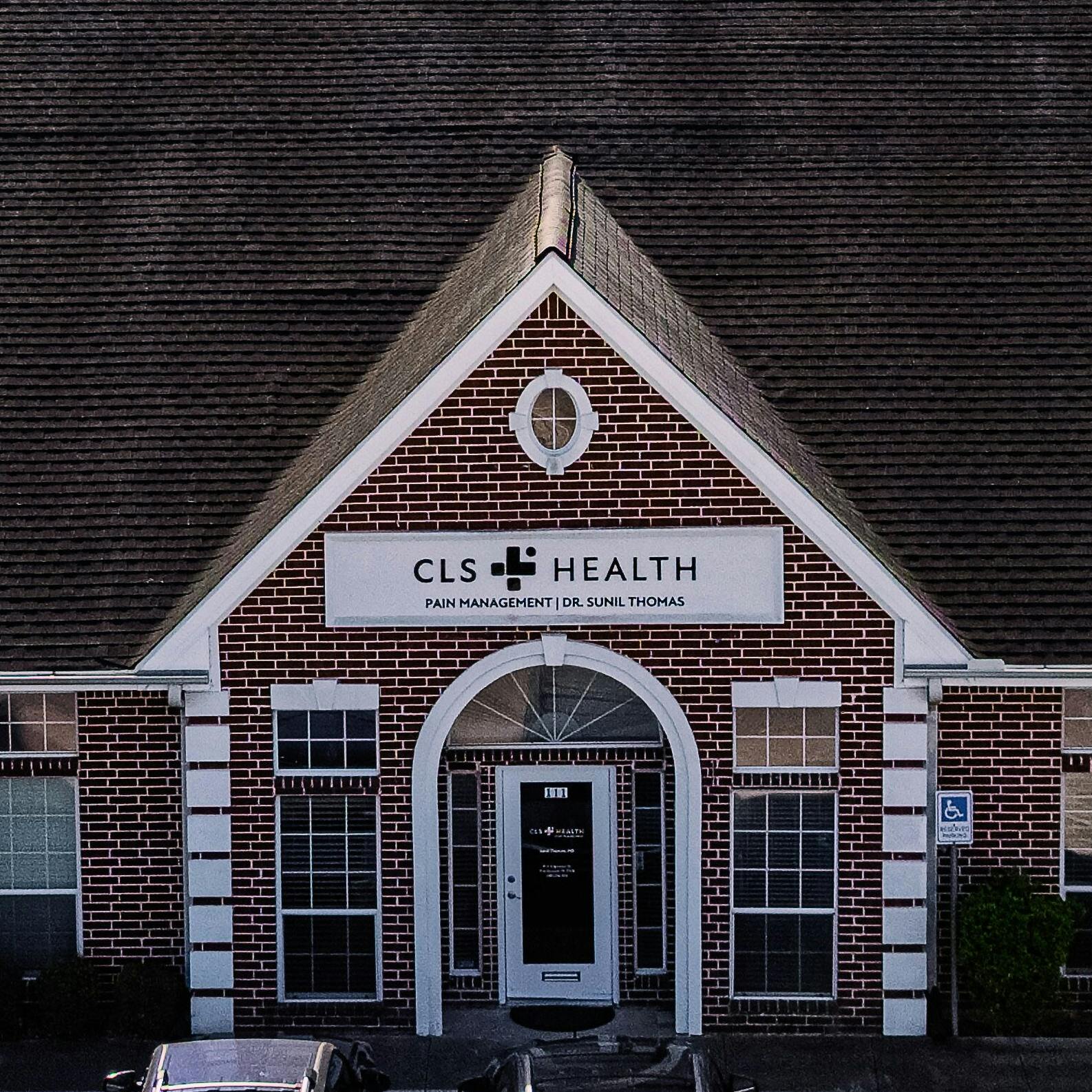 Exterior view of CLS Health Pain Management Associates - Friendswood, featuring the clinic entrance.