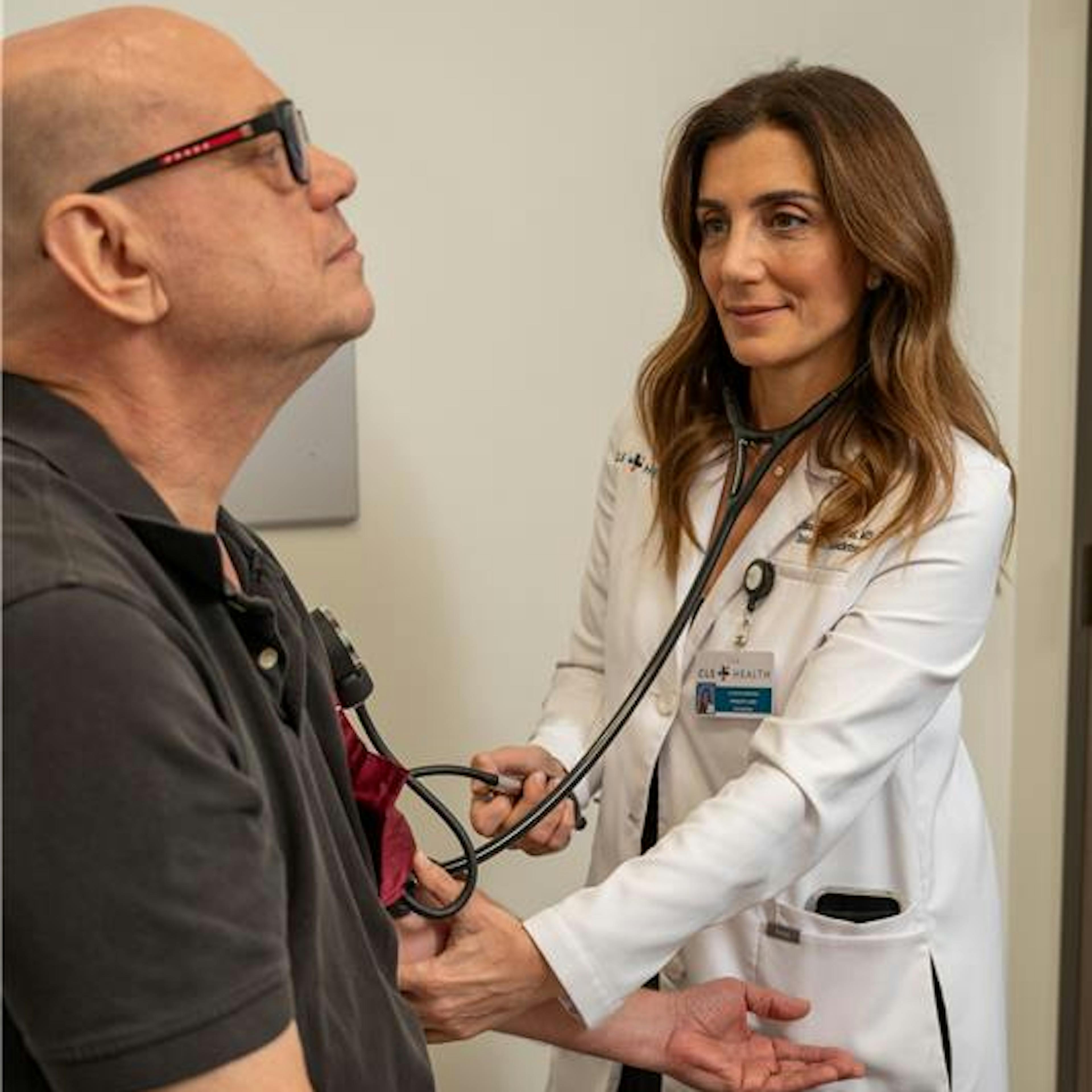 CLS Health primary care provider, Dr. Claudia Makhoul, performing diagnostics on a patient.